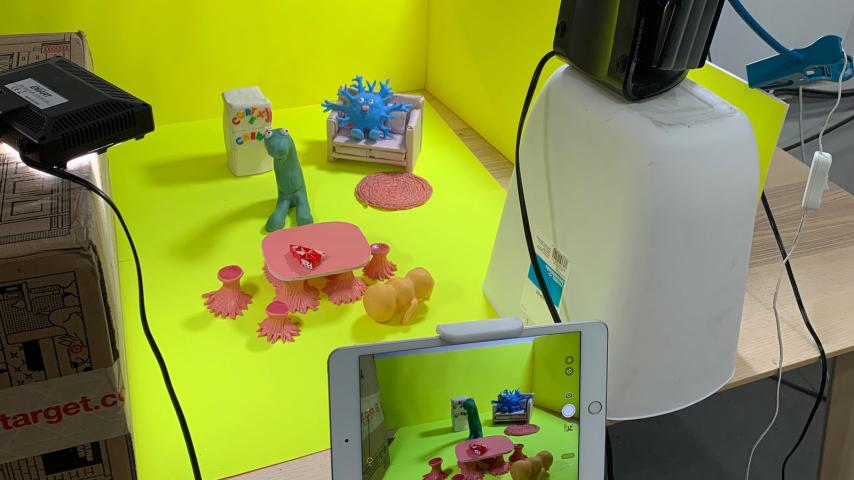 A "Cortex Crew" scene setup is shown in the background, with the scene visible on an iPad screen in the foreground