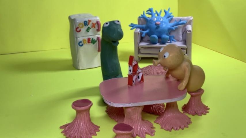 Clay figures from "The Cortex Crew" in a setup for a stop-motion photo shoot