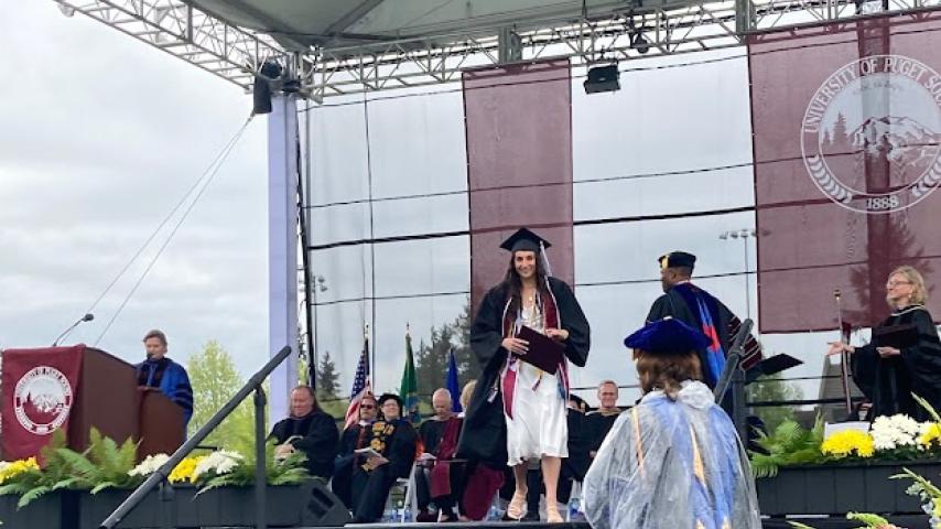 Jordan Holman walks across the stage after receiving her diploma.