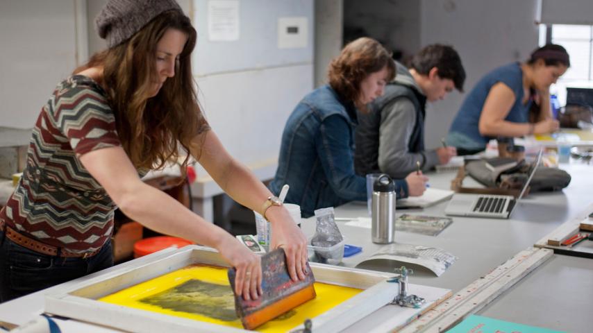 Art students creating in the print making studio