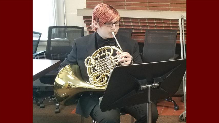 Brass Camp 2022 attendee playing the French Horn