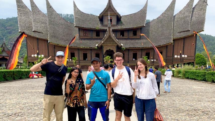 Nicholas Navin and group in front of Indonesian building