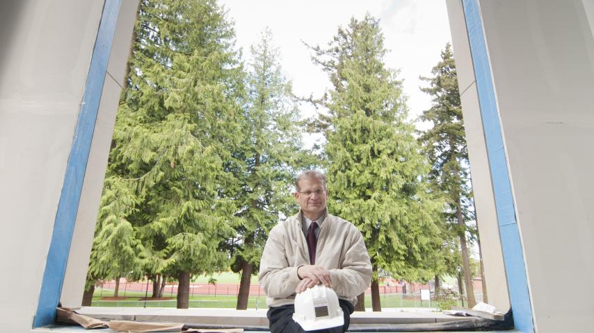 President Ron Thomas at the construction site of Weyerhaueser Hall.