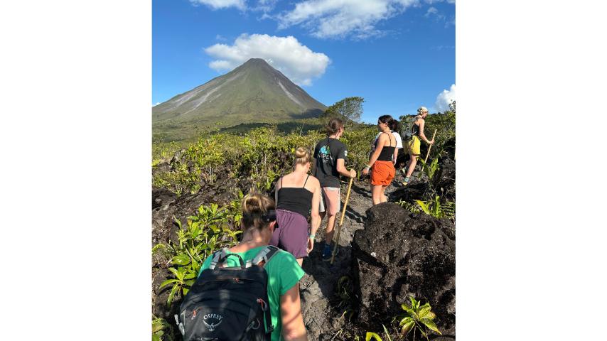 Georneys participants hike below the Arenal Volcano in Costa Rica, 2023.
