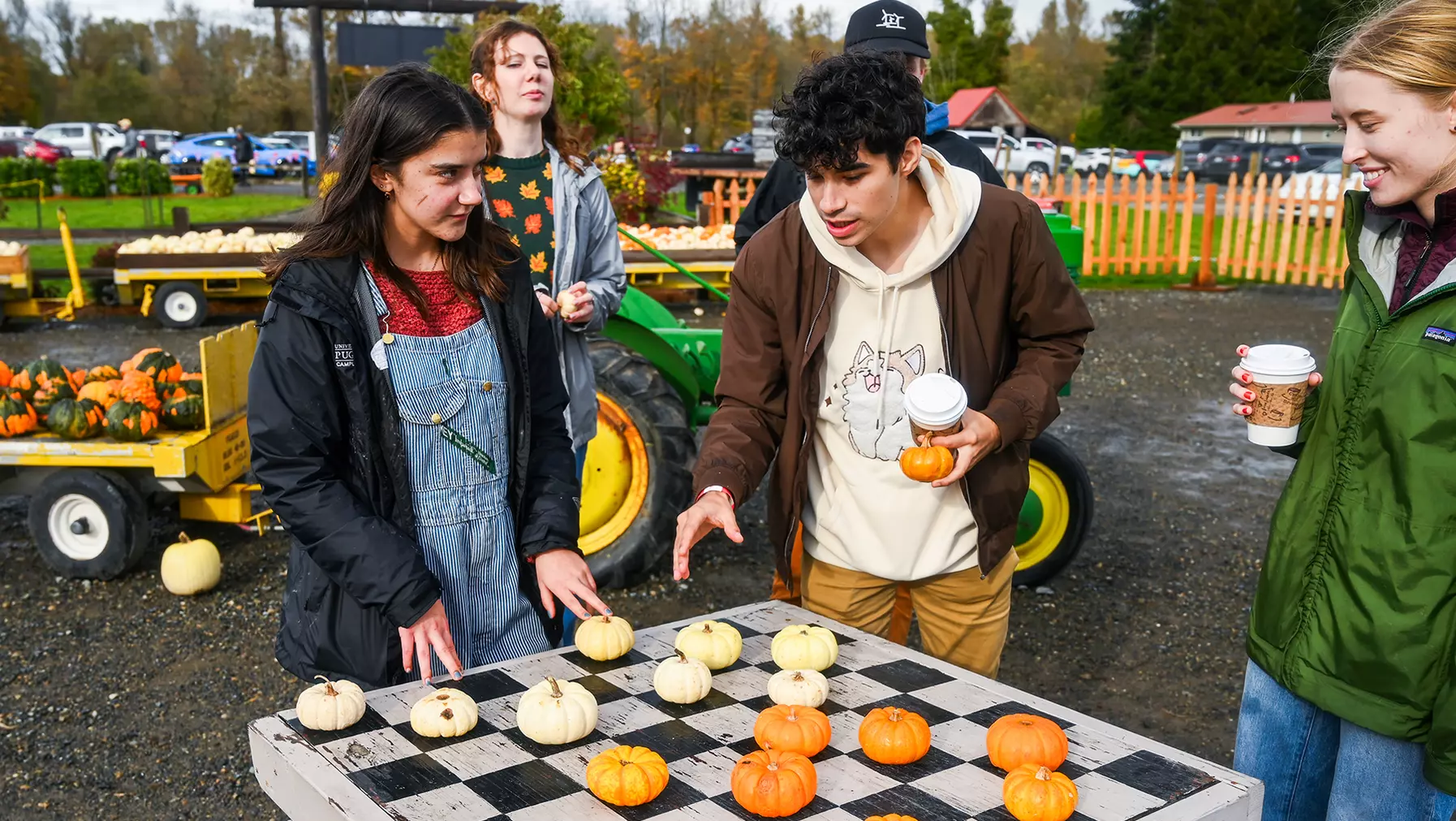 Luna Wagner '27 and Levin Kapur '28 play checkers