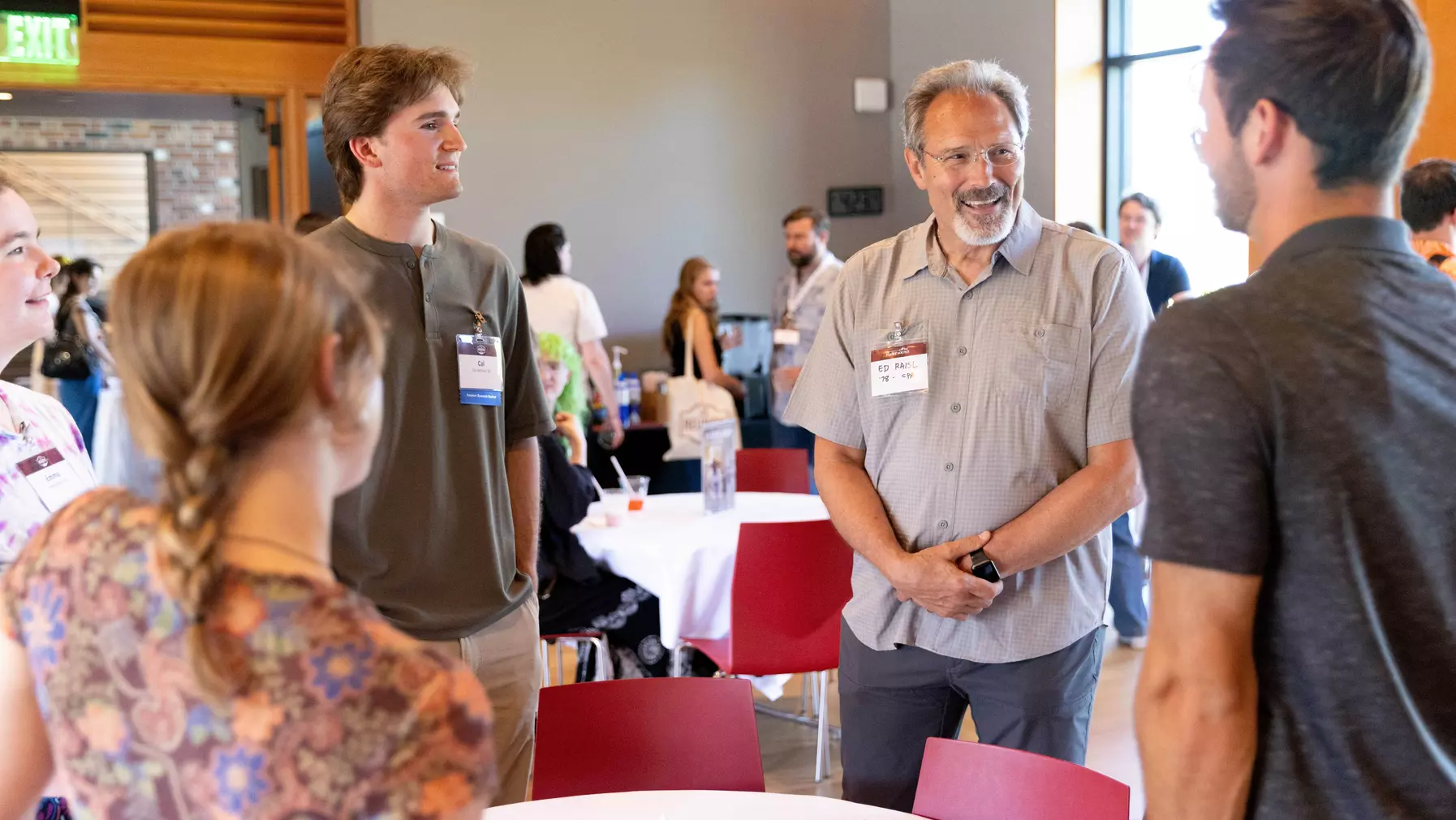 Alumni and students chatting at the Alumni & Student Mixer.