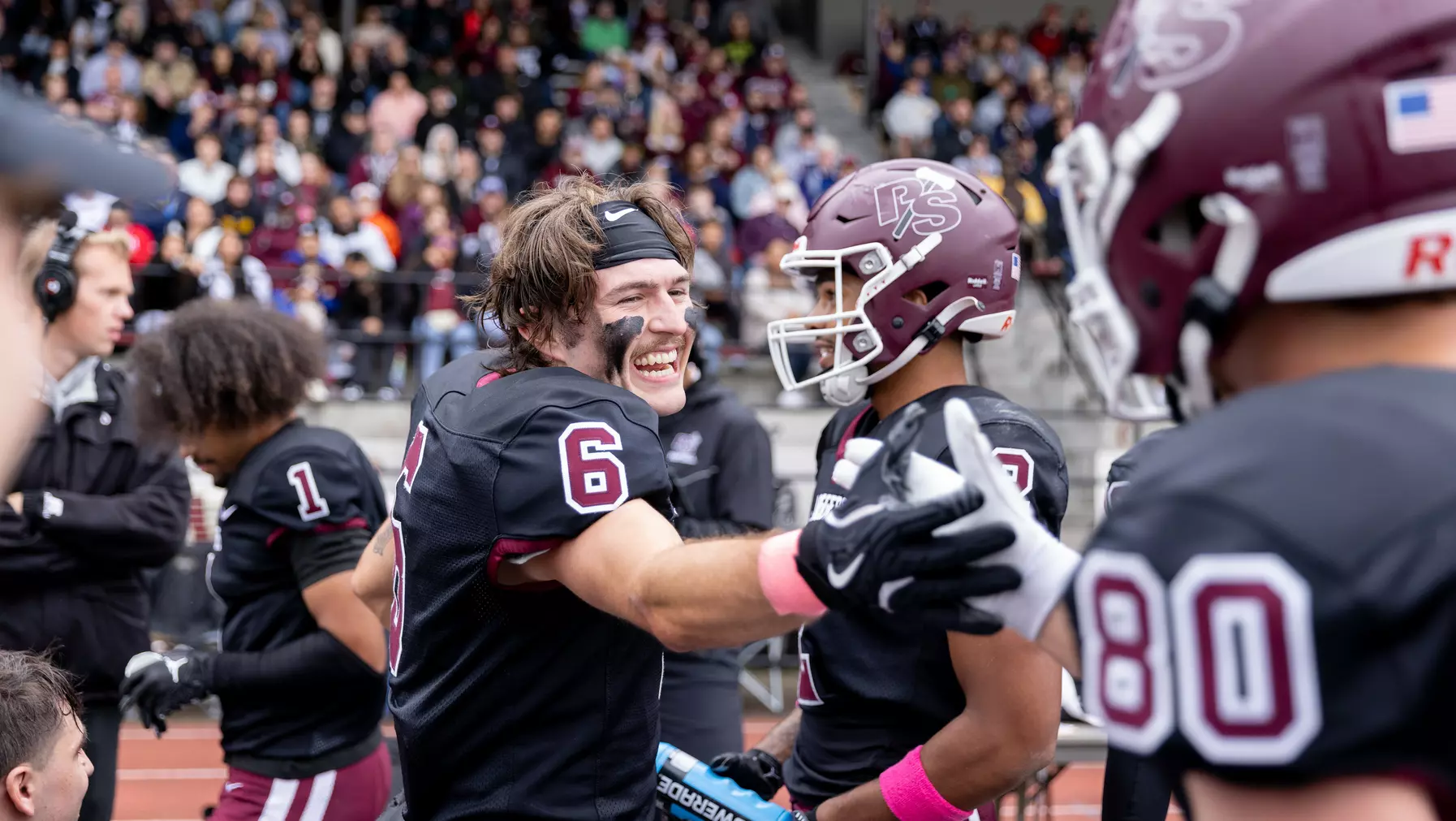 Jake Elorduy ’26 gives a high-five to a teammate after a Logger Football game.