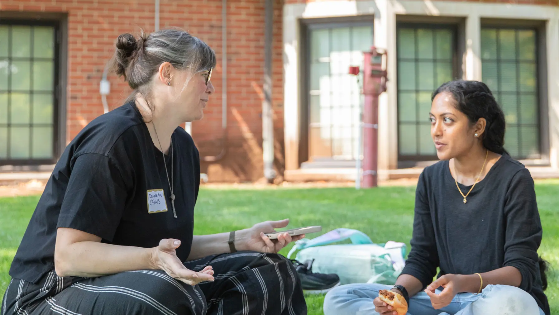 Two international students talking outside