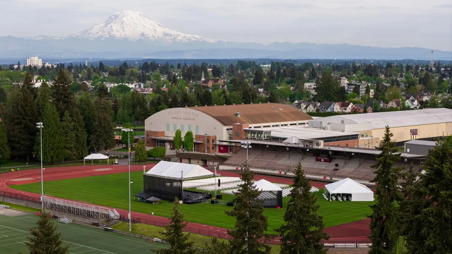 Setup for Commencement 2026 at Baker Stadium with Mount Rainier in the background