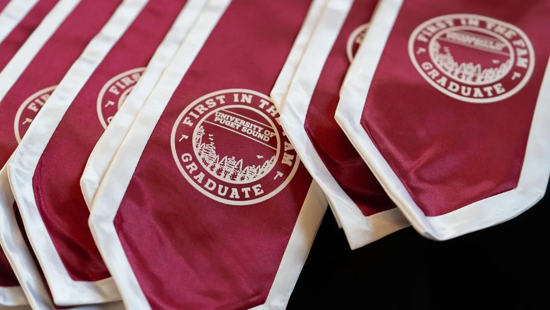 First in the Fam stoles for First Generation students at Commencement 2026