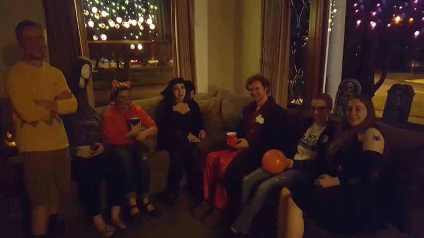 A group of people sitting on some couches.