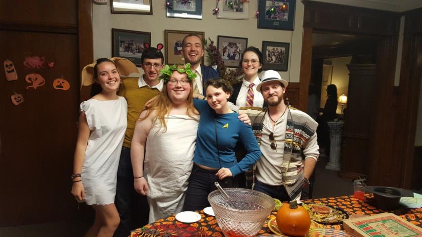A group of people standing together wearing costumes.