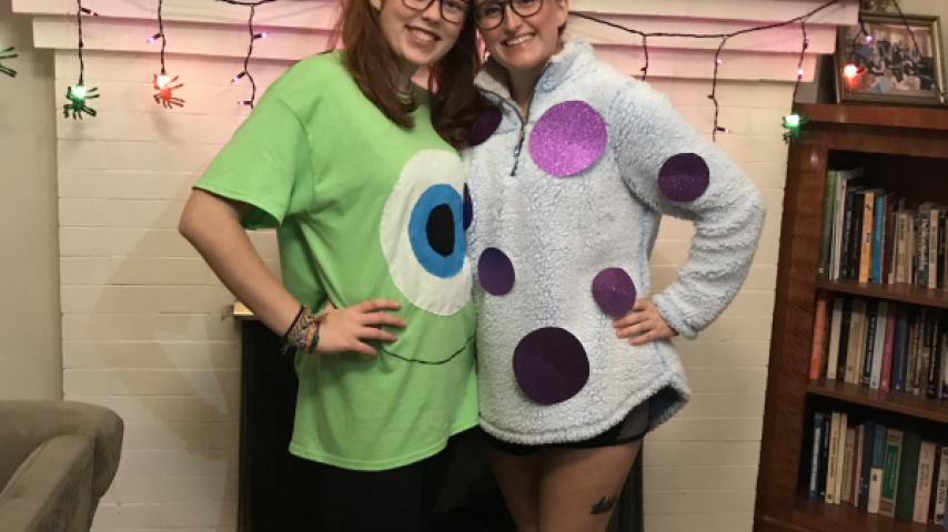 Two people wearing costumes.