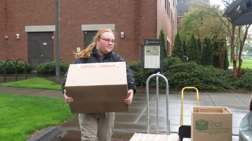 A person carrying a box.
