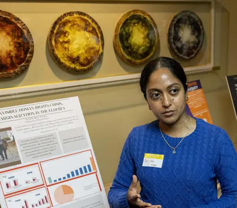 Student presenting research at symposium