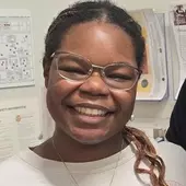 Smiling Profile photo of Olivia Kent-Hotron '27, the BAU's social media manager