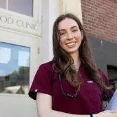Cecilia Turetzky volunteers at the Neighborhood Clinic. She received the Hurley Scholarship to start a blood pressure clinic, and has screened hundreds of community members and provided resources like education, blood pressure monitors, and food vouchers to help people buy heart-healthy food. 