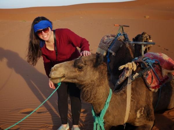 Amanda Klein with a camel in the Middle East