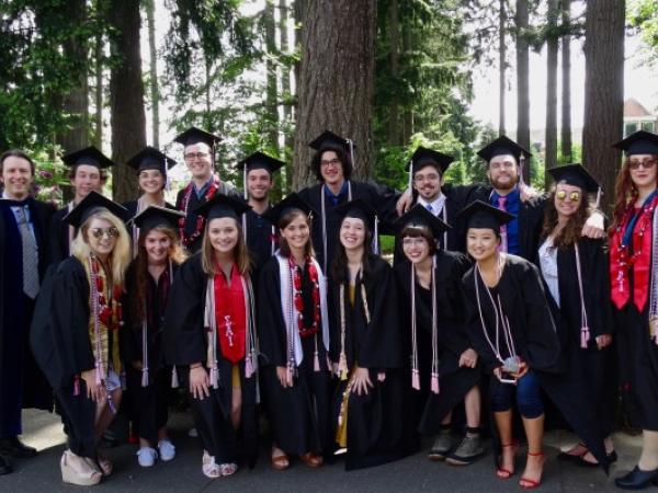 Graduate students wearing caps and gowns