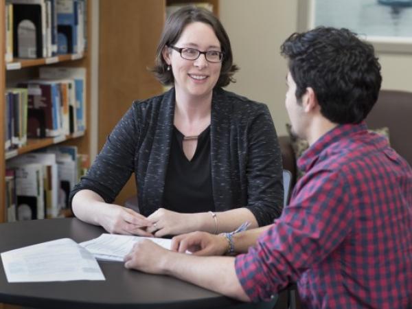Elizabeth Wormbecker '05, assistant director of student employment programs, training, and development, talks with a student.
