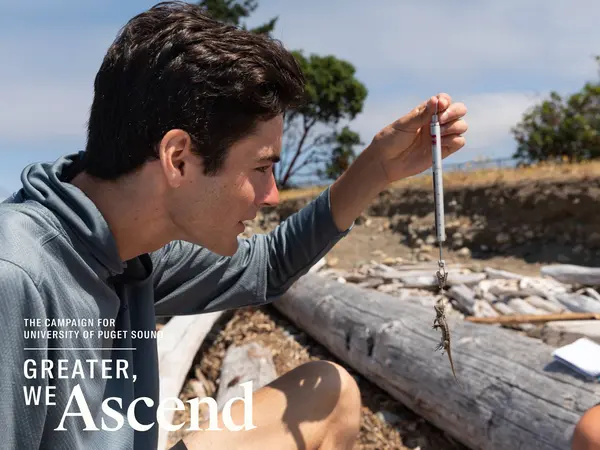 A student conducts summer research in the field.