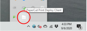 screenshot indicating that the PaperCut Print Deploy Client icon can be found in the lower right taskbar by clicking the up arrow