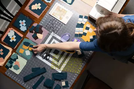 Prof. Tiffany MacBain constructing a quilt.
