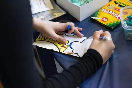 hands coloring a picture