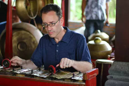 Professor Gareth Barkin playing in a gamelan orchestra