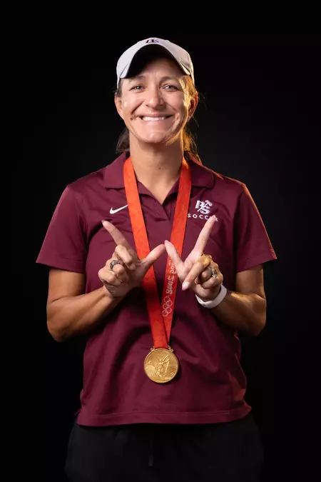 Logger Women's Head Coach Stephanie Cox with her Olympic gold medal.