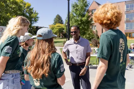 President Crawford talks with students.