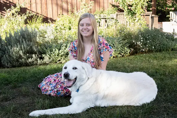 headshot of lily with her dog