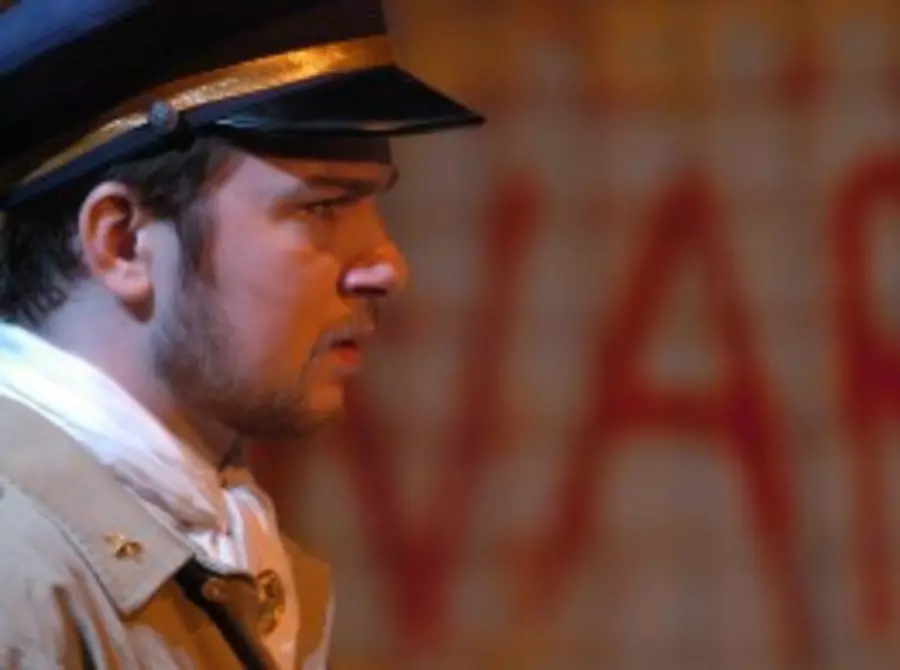 Side profile of actor in hat